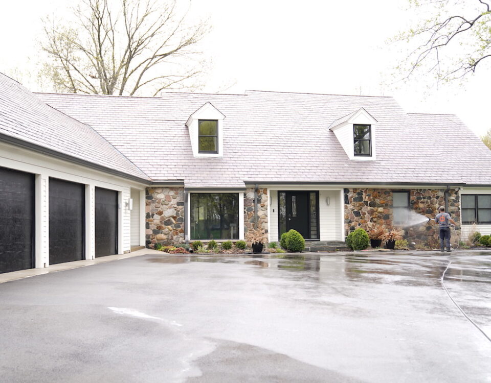 forte surfaces cleaning the side of a house