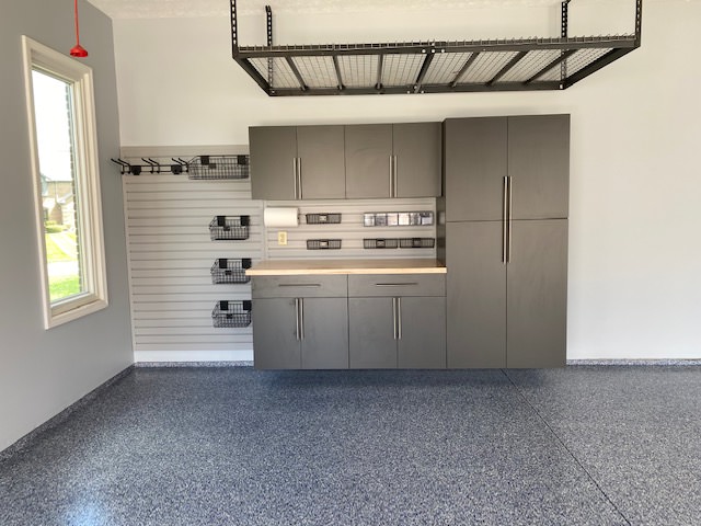epoxy flooring installed in a residential garage around a work station