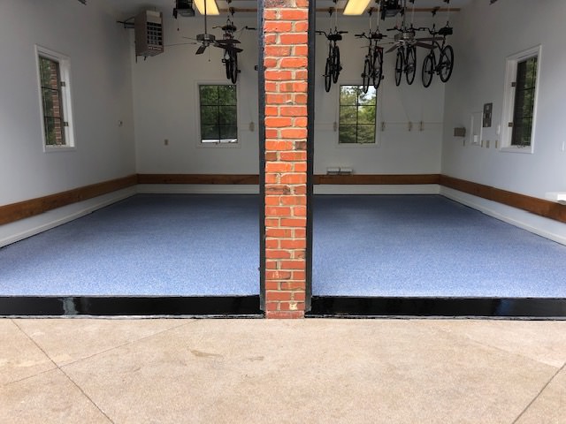 epoxy floor installation in a garage with blue and white specks