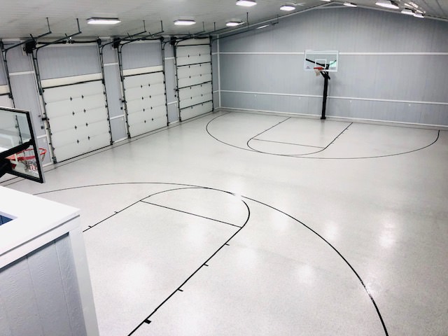 epoxy floor installation over a basketball court inside