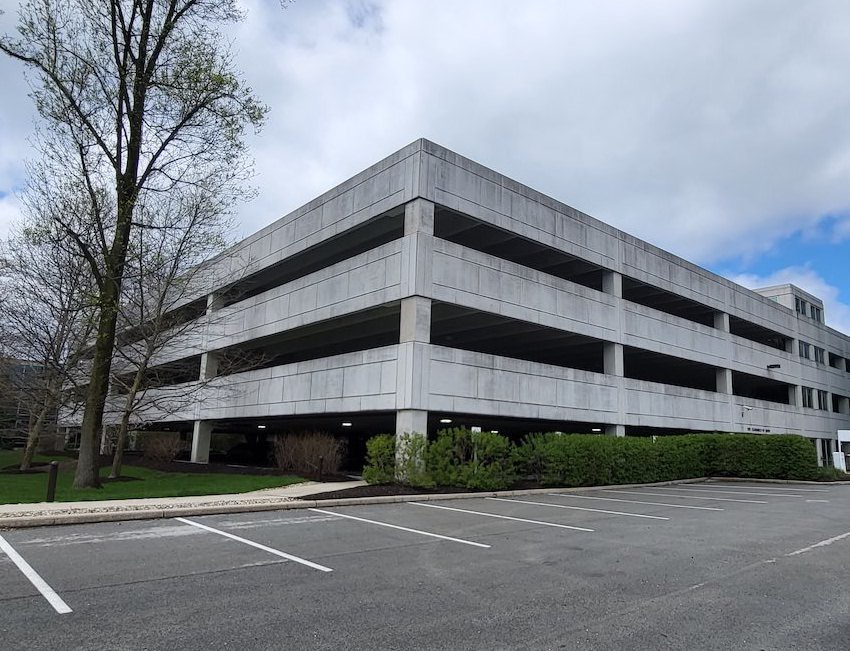 a large building with a parking lot in front of it