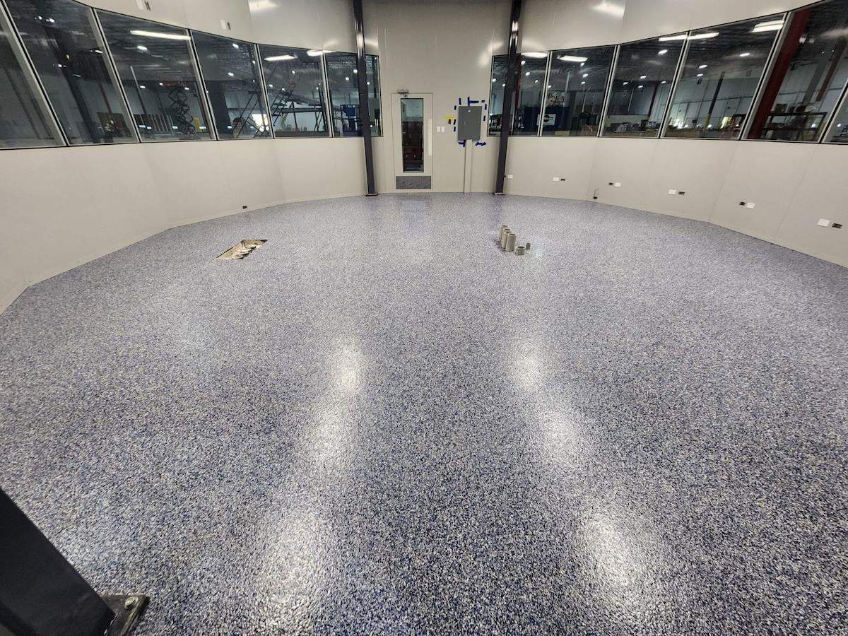 a control center room in a commercial building with an epoxy floor